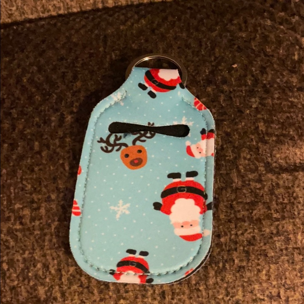 FREE w/$25 purchase Santa/Reindeer SanitizerHolder